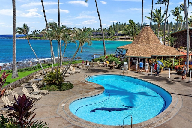 view of swimming pool with a gazebo, a patio area, and a water view