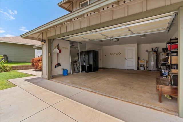 19 Heona Pl, Kihei, HI 96753 - garage with electric water heater, a garage door opener, driveway, and gas water heater