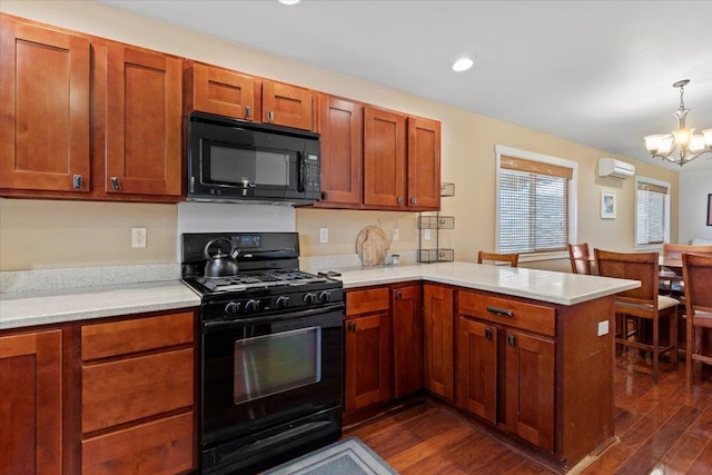 19 Heona Pl, Kihei, HI 96753 - kitchen with black appliances, a peninsula, light countertops, a wall mounted air conditioner, and recessed lighting
