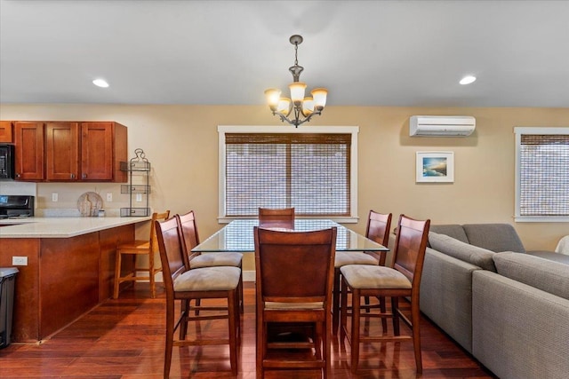 19 Heona Pl, Kihei, HI 96753 - dining space featuring a wall mounted air conditioner, dark wood-type flooring, a chandelier, and recessed lighting