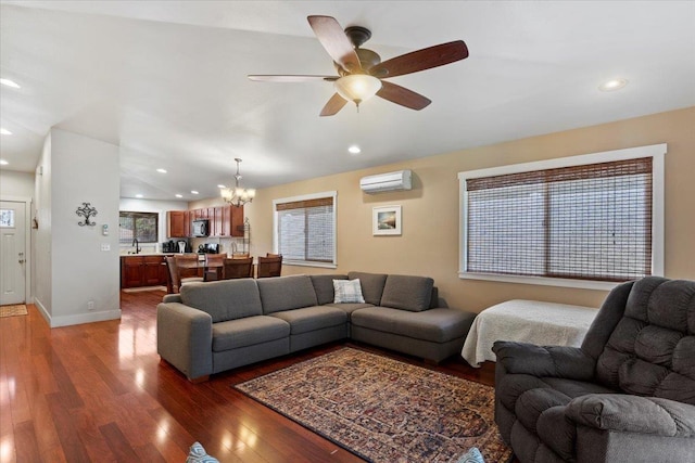 19 Heona Pl, Kihei, HI 96753 - living area featuring a chandelier, an AC wall unit, ceiling fan, wood finished floors, and recessed lighting