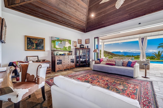 tiled living room with ceiling fan, high vaulted ceiling, and wood ceiling