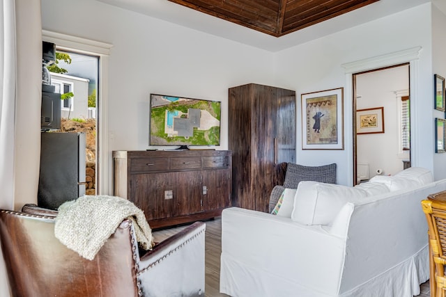 living room featuring wooden ceiling and hardwood / wood-style floors