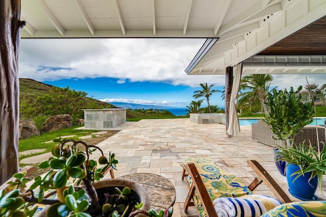 view of terrace with a mountain view