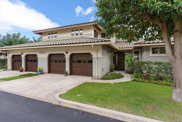 view of front facade featuring a front lawn and a garage