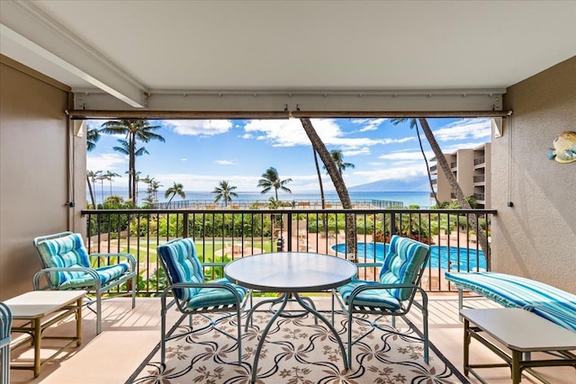 balcony featuring a water view