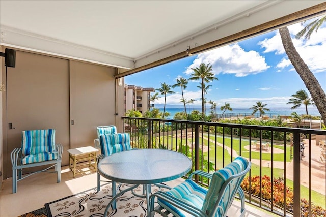 balcony featuring a water view