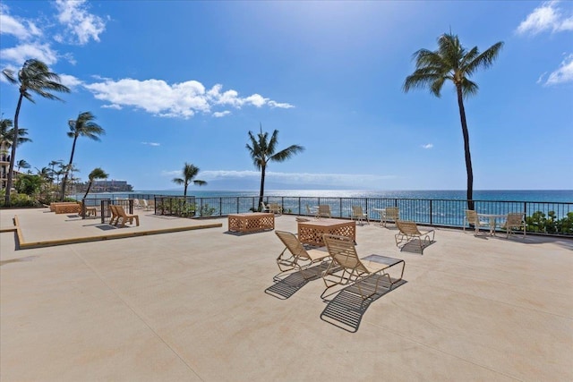 view of patio with a water view