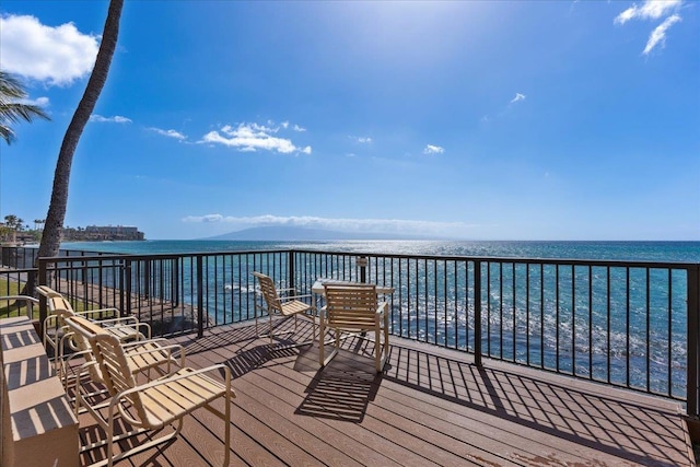 wooden deck featuring a water view