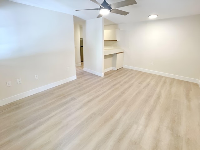 unfurnished living room with light hardwood / wood-style floors and ceiling fan