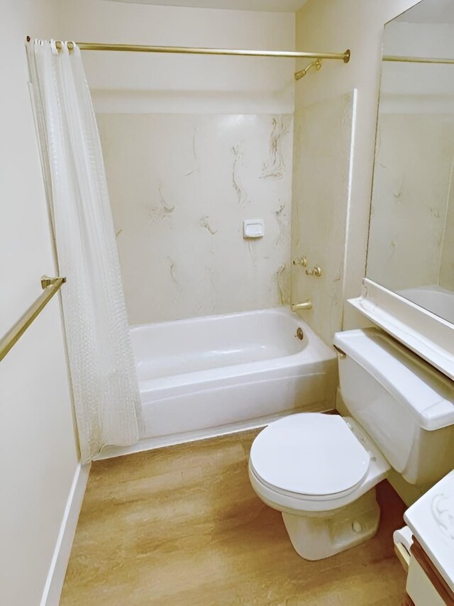 full bathroom featuring shower / bath combo with shower curtain, vanity, wood-type flooring, and toilet