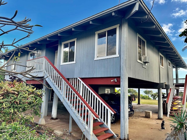 view of side of property with cooling unit