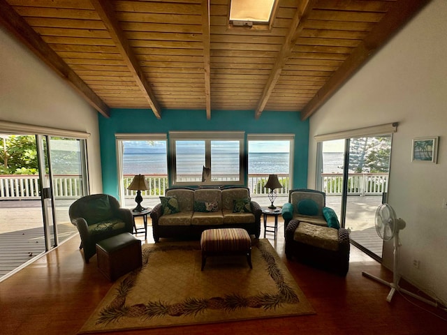 sunroom / solarium with a water view, vaulted ceiling with beams, plenty of natural light, and wooden ceiling