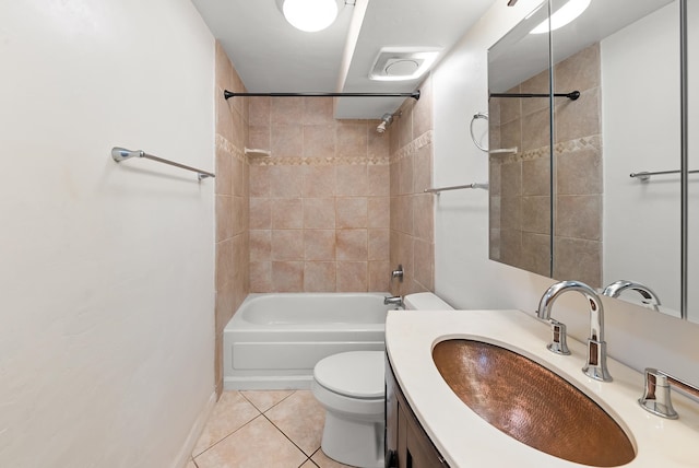 full bathroom with tiled shower / bath, vanity, toilet, and tile patterned flooring