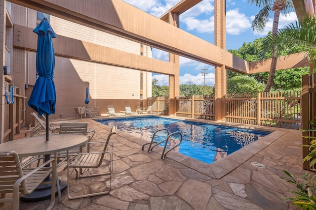 view of swimming pool featuring a patio