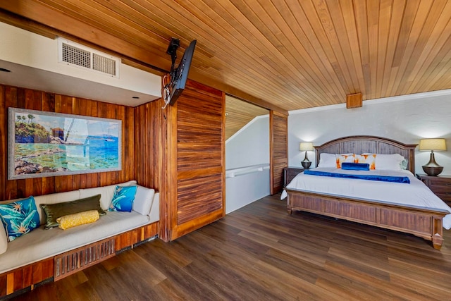 bedroom with wooden walls, wood ceiling, and dark hardwood / wood-style floors