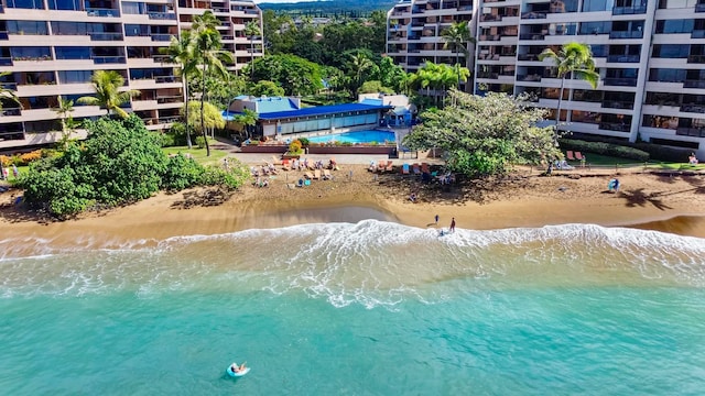 drone / aerial view with a water view and a view of the beach