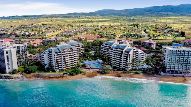 birds eye view of property with a beach view and a water and mountain view