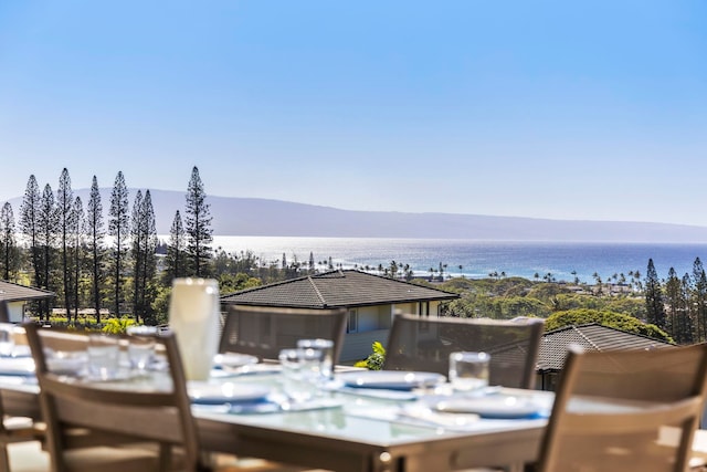 exterior space featuring a water and mountain view