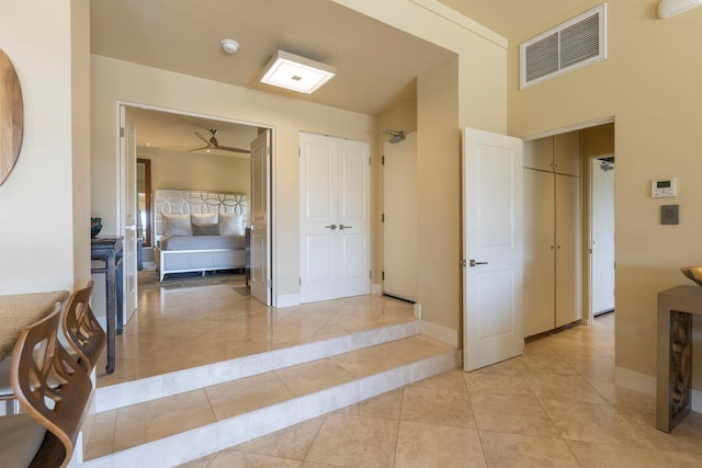 hallway featuring light tile patterned flooring