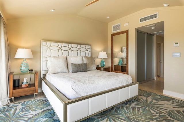 bedroom with crown molding and vaulted ceiling