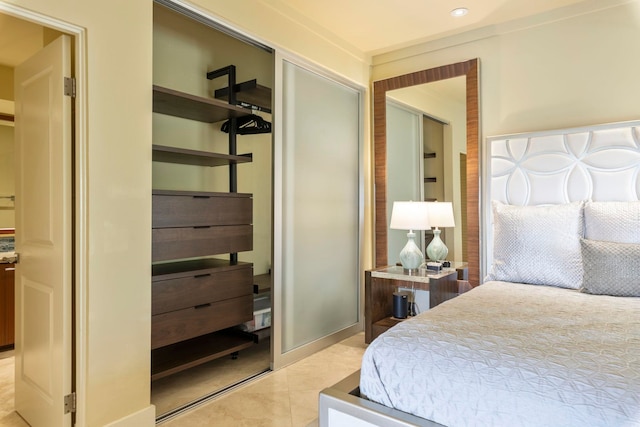 tiled bedroom with a closet