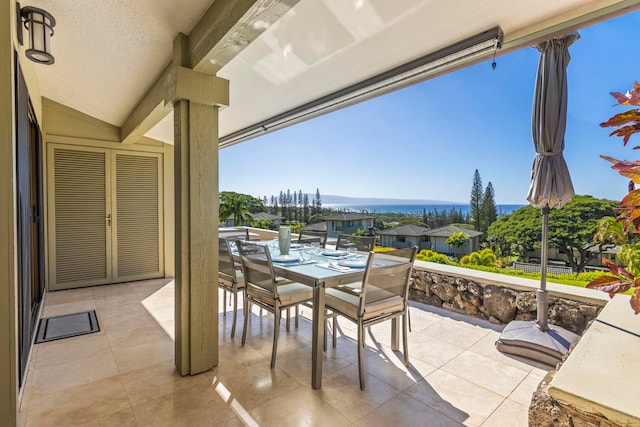 view of patio / terrace with a water view