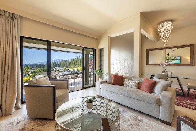 living room featuring a mountain view, vaulted ceiling, and light tile patterned flooring