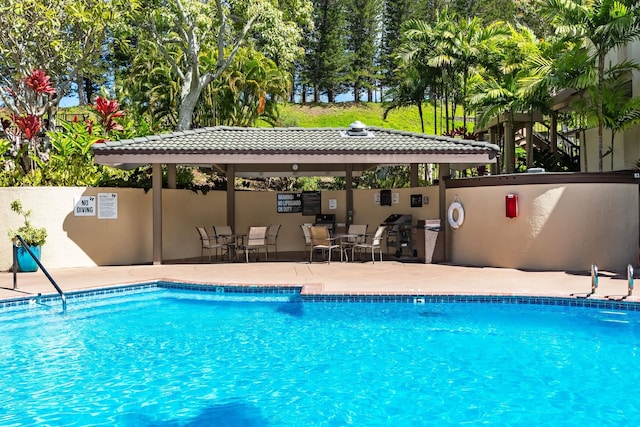 view of swimming pool with a gazebo