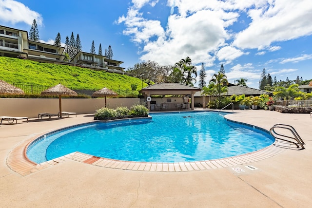 view of pool featuring a gazebo and a patio area