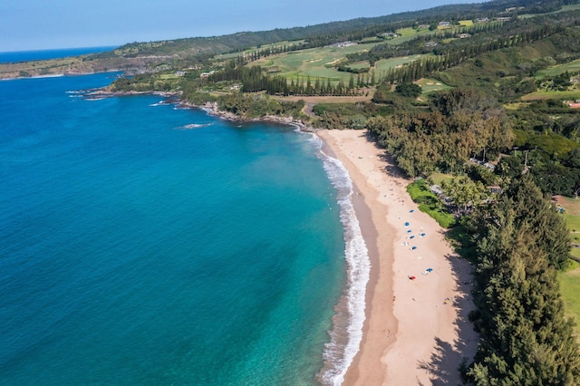 bird's eye view featuring a water view and a beach view