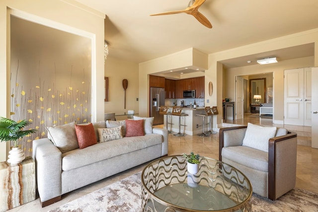 tiled living room with ceiling fan