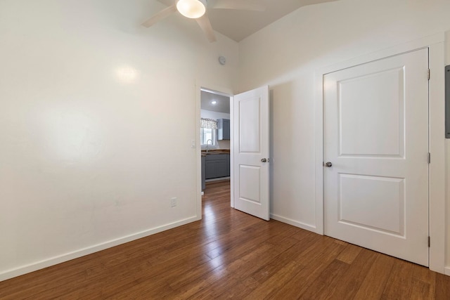534 Kaikoo Pl, Wailuku, HI 96793 - unfurnished bedroom featuring wood finished floors, a sink, lofted ceiling, a ceiling fan, and baseboards