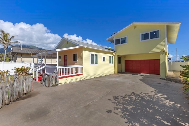 534 Kaikoo Pl, Wailuku, HI 96793 - view of front of property with a garage and a porch