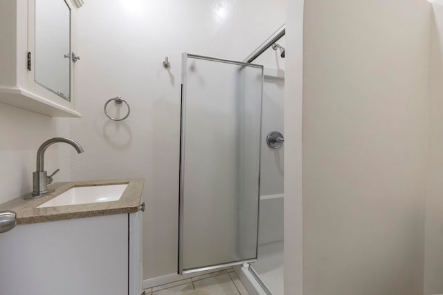 534 Kaikoo Pl, Wailuku, HI 96793 - bathroom featuring a stall shower, vanity, and tile patterned floors