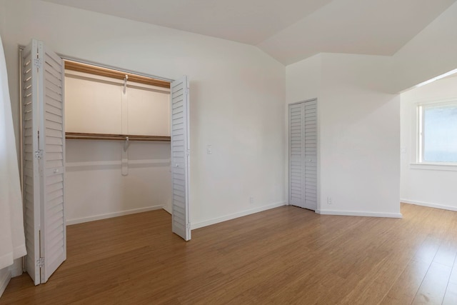 534 Kaikoo Pl, Wailuku, HI 96793 - unfurnished bedroom with light wood-type flooring, baseboards, and vaulted ceiling