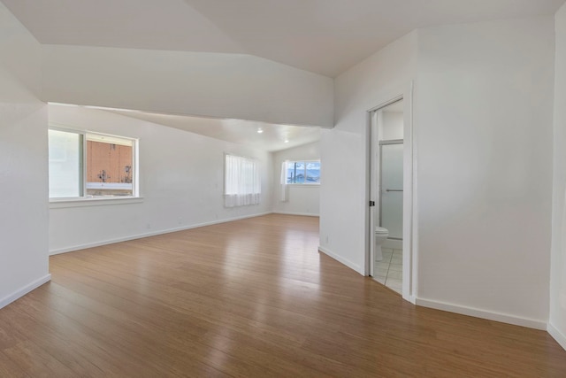534 Kaikoo Pl, Wailuku, HI 96793 - empty room with wood finished floors, vaulted ceiling, and baseboards