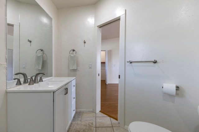 534 Kaikoo Pl, Wailuku, HI 96793 - bathroom with vanity, toilet, tile patterned floors, and baseboards