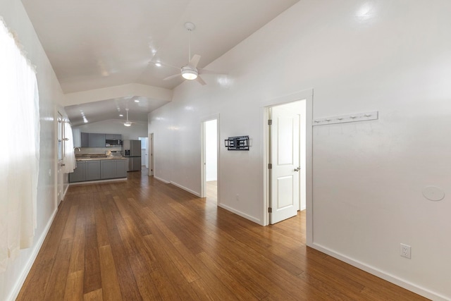 534 Kaikoo Pl, Wailuku, HI 96793 - unfurnished living room with lofted ceiling, dark wood-style floors, ceiling fan, and baseboards