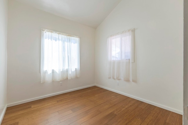 534 Kaikoo Pl, Wailuku, HI 96793 - unfurnished room with lofted ceiling, wood finished floors, and baseboards
