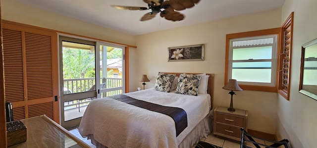 tiled bedroom featuring ceiling fan and access to exterior