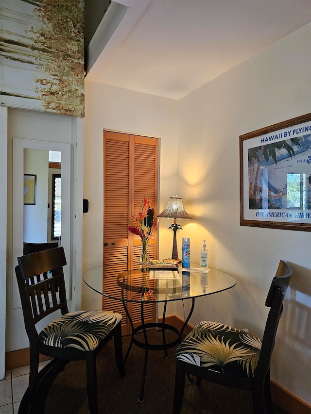 dining area with light tile patterned floors