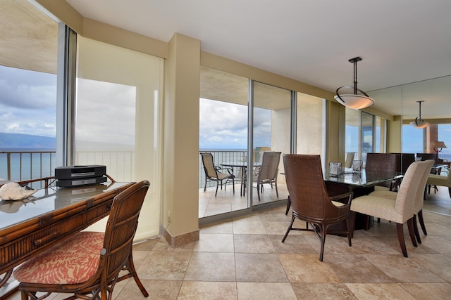 dining space with a water view