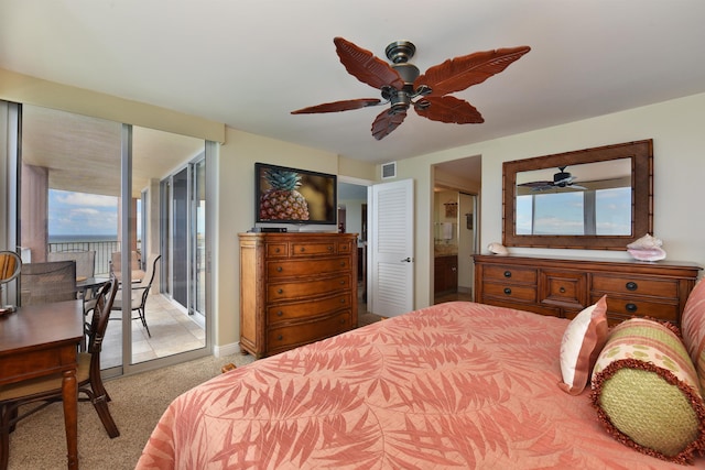 carpeted bedroom with connected bathroom, access to exterior, and ceiling fan