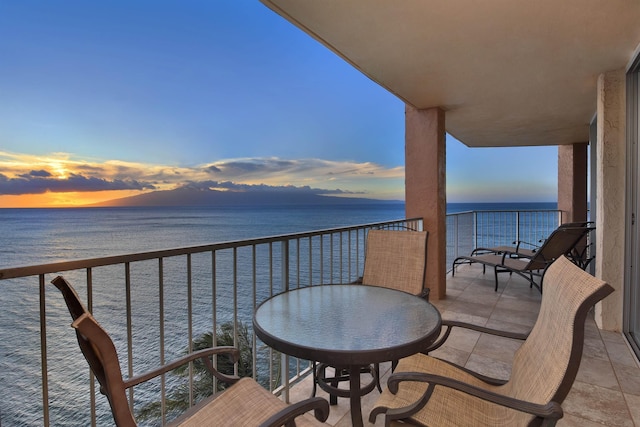 balcony at dusk with a water view