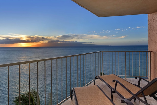 balcony at dusk with a water view