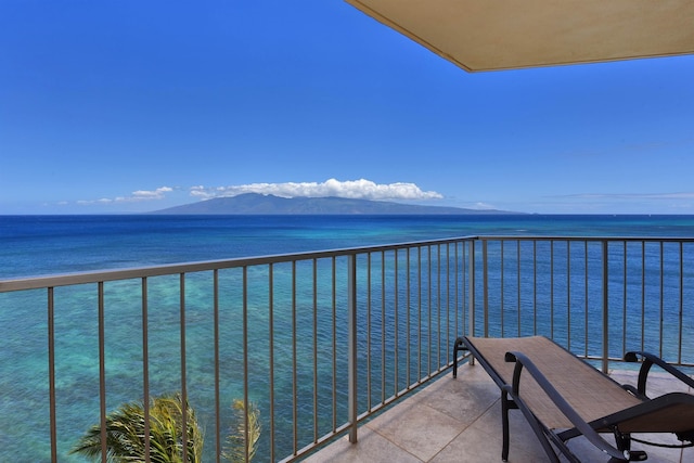 balcony with a water and mountain view