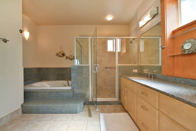 bathroom with a stall shower, tile patterned flooring, a bath, and vanity