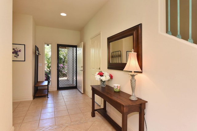 entrance foyer with light tile patterned floors, recessed lighting, and baseboards