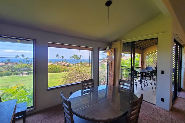 dining area with carpet flooring and lofted ceiling